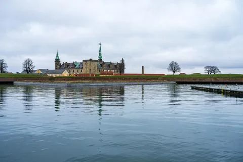 A cloudy view to Kronborg Castle in winter from a pier Stock Photos