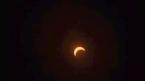 Cloudy View of Partial Eclipse. Stock Photos