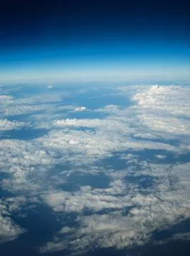 Cloudy view on sky from airplane Stock Photos