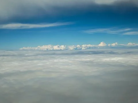 Cloudy view on sky from airplane Stock Photos