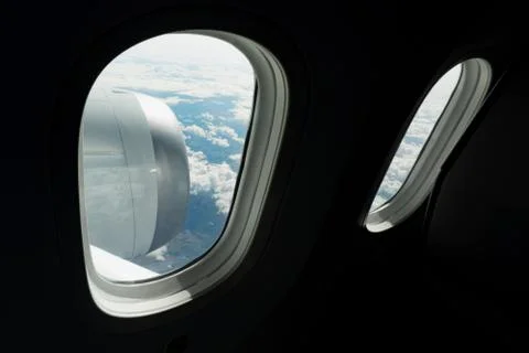 Cloudy view through the aircraft window Stock Photos
