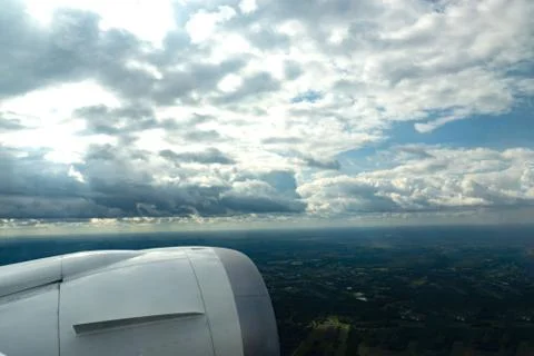 Cloudy view through the aircraft window Stock Photos