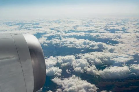 Cloudy view through the aircraft window Stock Photos