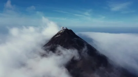 Cloudy volcano eruption in Guatemala captured by drone Stock Footage 308432996