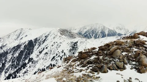 Cloudy weather in the mountains in winter Stock Footage 122235450