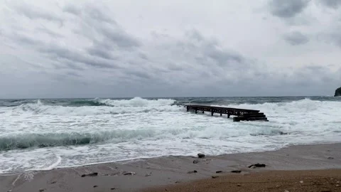 Cloudy weather, stormy wind, stormy sea waves roll onto the shore, Adriatic Stock Footage 280685466
