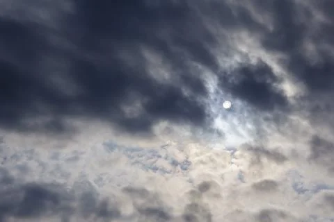 Cloudy weather, the sun through the clouds, gloomy depressive background Stockfoto's