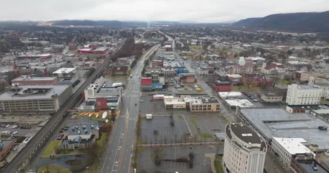 Cloudy winter aerial video of the downtown area in the City of Elmira, NY. Stock Footage 268503043