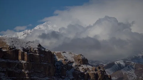 Cloudy winter in the mountains, time lapse from the rooftop Stockbeeldmateriaal 121964039