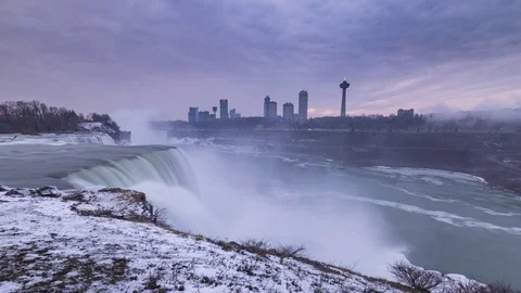 Cloudy winter sunset at Niagara Falls from the New York side Stock Footage 73276980