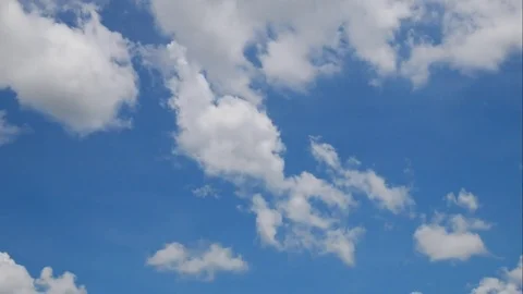 Clound moving on blue background timelapse seen. Stock Footage 78697318