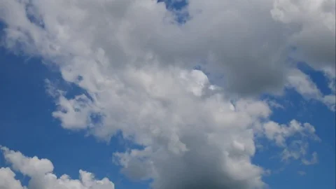 Clound moving on blue background timelapse seen. Stock Footage 78697329