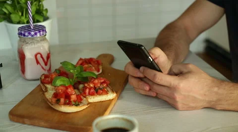 Clous up man sending text message in restaurant Stock Footage 67992475