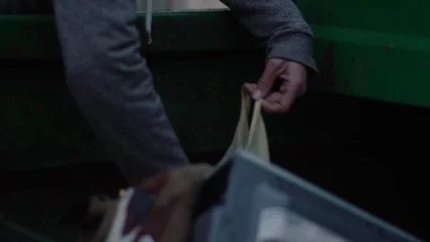 Clouse up. Hands of an old poor Man looking for food in the garbage Stock-Footage 104542861