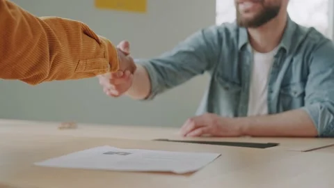 Clouse up handshake HR managers satisfied about male job employee, have positive Stock Footage 234063395