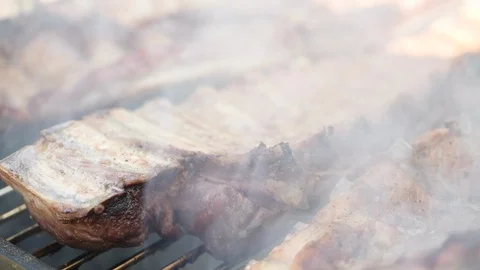 Clouse up ribs on the bbq Stock Footage 93390378