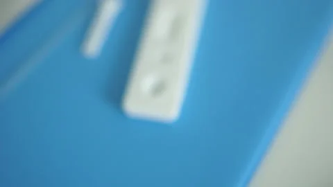 Clouse up unpacked kit of rapid test covid-19 - test cassette, pipette, reagent Stock Footage 130411343