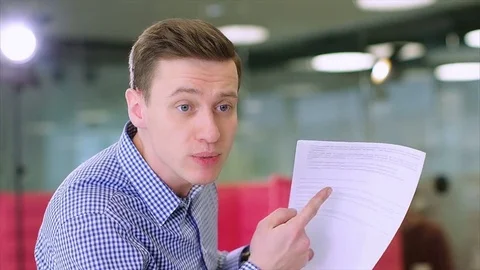 Clouse up of young businessman criticizes the work of a colleague Stock Footage 73516396