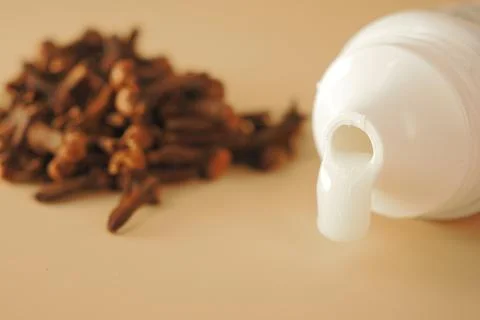 Clove buds flavour tooth paste on a table Stock Photos