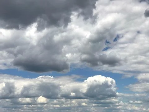Clover leaf cloud shape in dense cumulus formation  Stock Photos