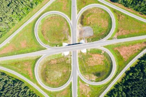 Clover or daisy, a simple and cheap type of road junction. Aerial view of Stock Photos