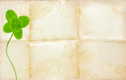 Clover symbol on old background with empty paper Stock Photos