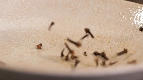 Cloves Fall on a Plate Closeup No. 2 Stock Footage 99164054