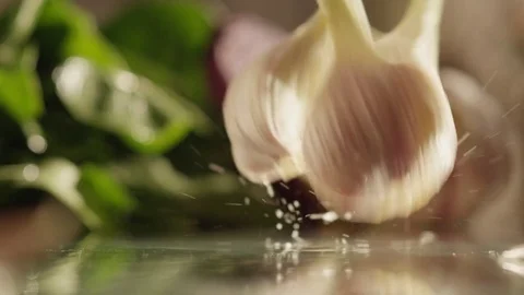 Cloves of garlic fall on glass RAPID 100fps (FEW SHOTS) Stock Footage 74654247