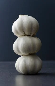 Cloves of garlic stack Stock Photos