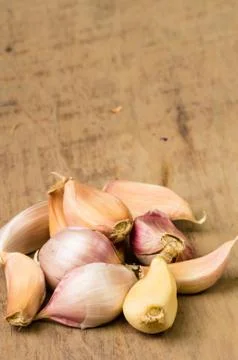 Cloves of garlic on table Stock Photos