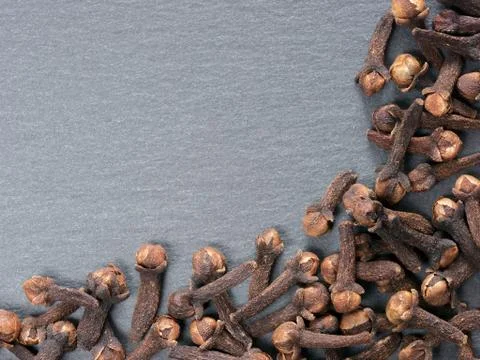 Cloves on slate background 스톡 사진
