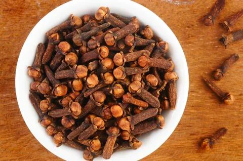 Cloves in white dish Stock Photos