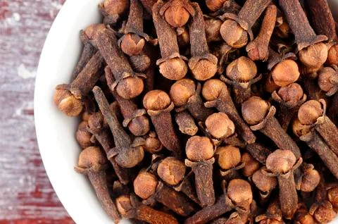 Cloves in white dish Stock Photos