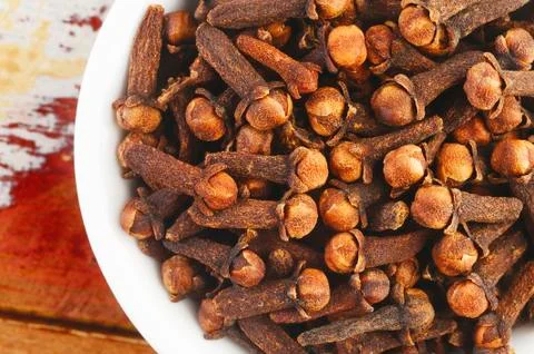 Cloves in white dish Stock Photos