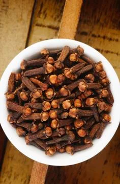Cloves in white dish Stock Photos