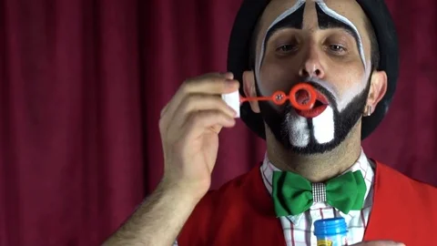 The clown blows soap bubbles Stock Footage 85173495