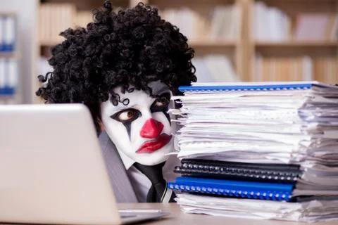 Clown businessman working in the office Stock Photos