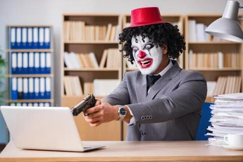 Clown businessman working in the office Stock Photos