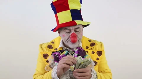 Clown counting money Stock Footage 61479468