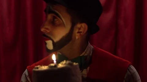 Clown extinguished candle Stock Footage 85017710