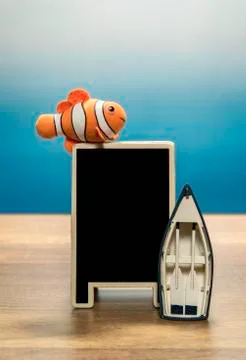Clown fish over blank back board and boat Stock Photos