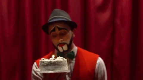 The clown has a candle cake Stock-Footage 85017715