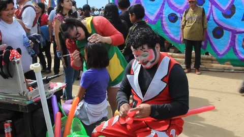 Clown Makes Balloon Animals at Sumpango Giant Kite Festival Stock Footage 346248050