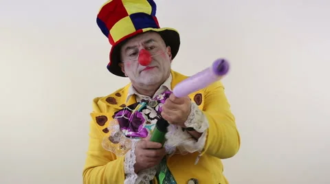 Clown makes a hare from the air ball Stock Footage 61825919