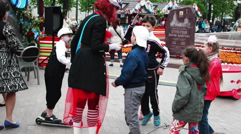 Clown Playing With the Children at the Fair Stock Footage 63129557