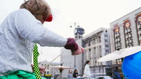 The clown is playing the drum set. Slow motion Stock Footage 91012255