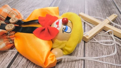 Clown Puppet Toy on a Table With Camera Turning Around Stock Footage 88407516