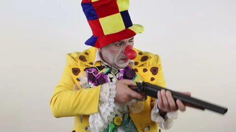 Clown with shotgun Stock Footage 61479475
