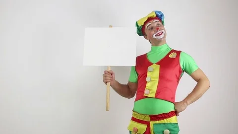 Clown with a sign for the label Stock Footage 72814989