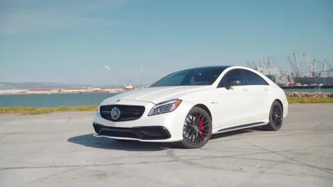CLS63S AMG Parked with water in the background Video stock 237200729